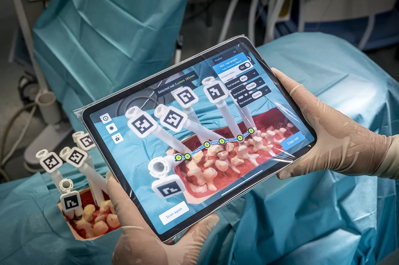 Tablet displaying AI-powered augmented reality guidance during spinal surgery, illustrating Neo’s innovative surgical platform.